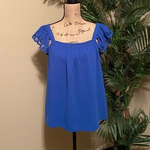 Blue sleeveless blouse!